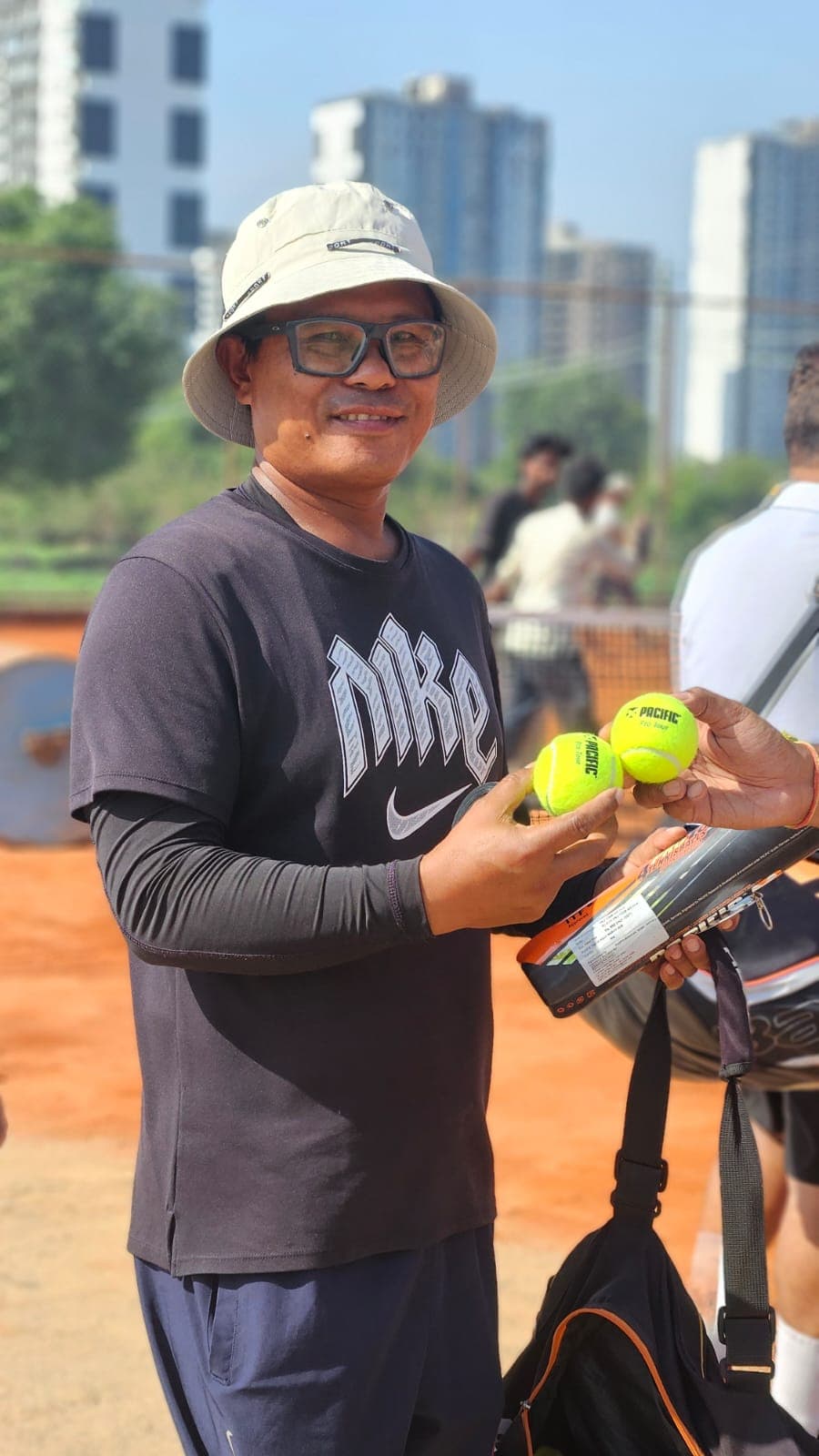Player hitting a backhand on clay court